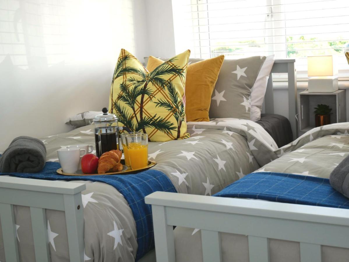 Seaside Serenity: 3-bedroom Garden Retreat With Beach Access
