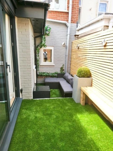 Coastline Retreats - Cloud9: Luxury Garden Flat With Modern Amenities Bournemouth
